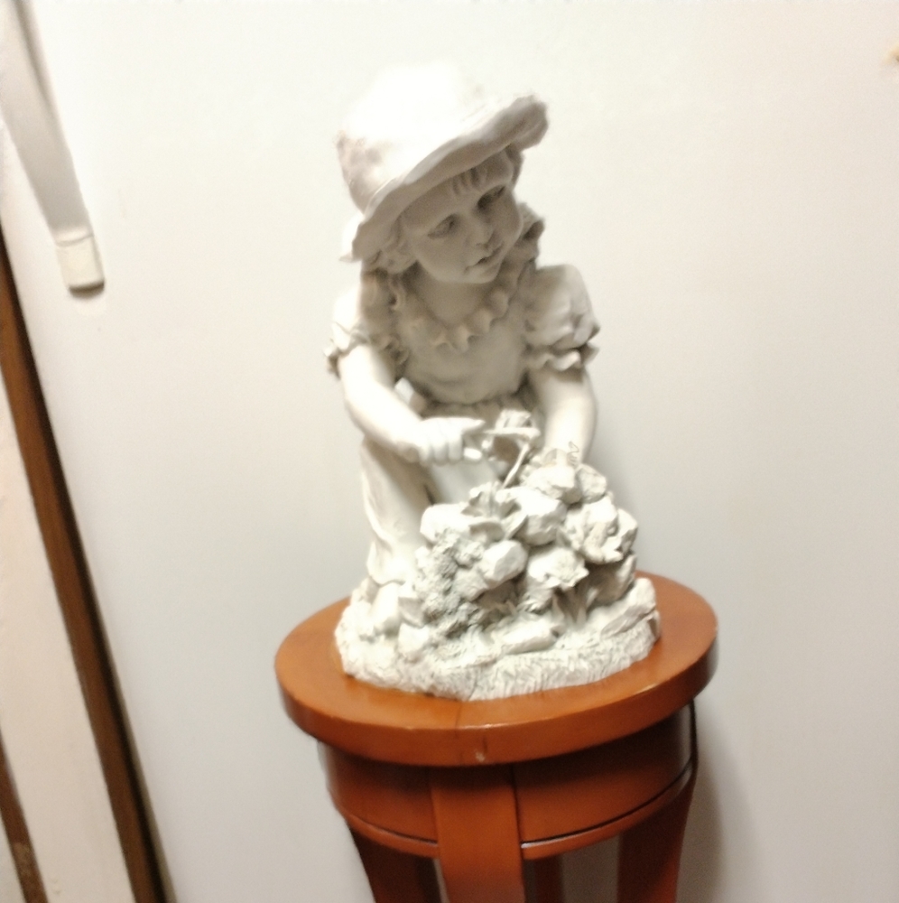 Solar girl watering flower